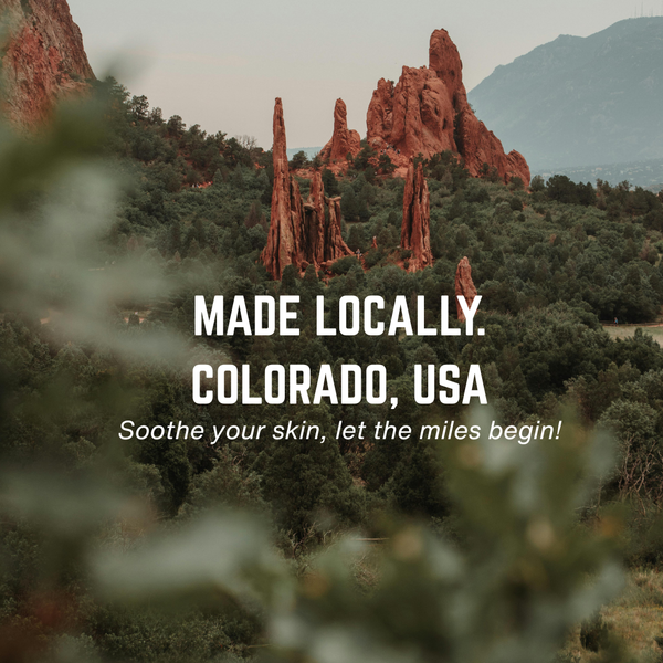 Anti Chafe localy made. Scenic view of red rock formations with greenery and text overlay in Colorado, USA.